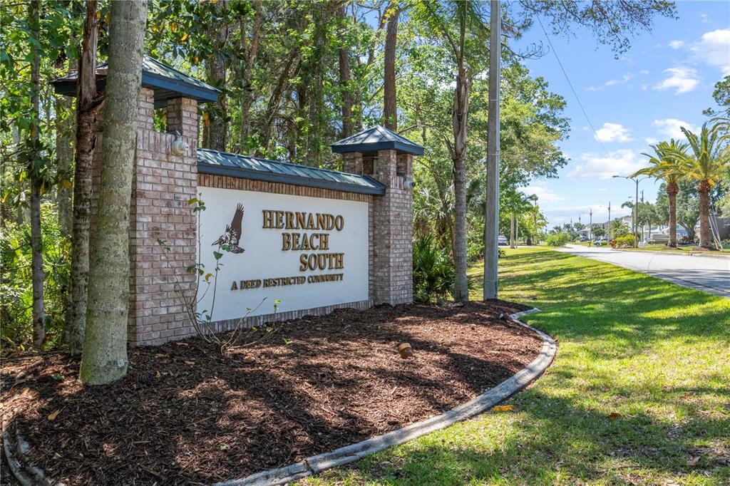 3336 Croaker Drive, Unit LOT 36 Hernando Beach, FL 34607 - Photo 9 of 20 a view of a house with a yard