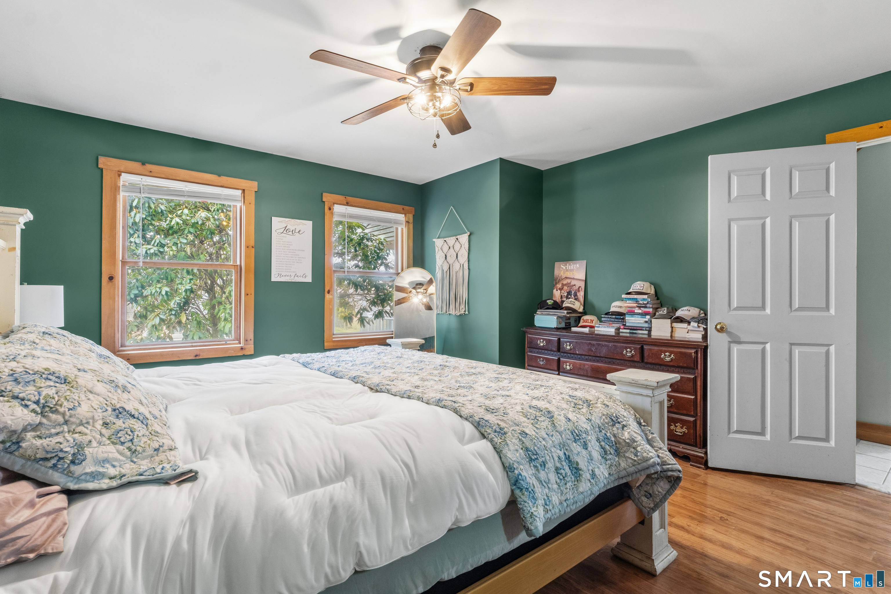 120 Hanover Versailles Road Sprague, CT 06330 - Photo 11 of 26 a bedroom with a bed and a chandelier