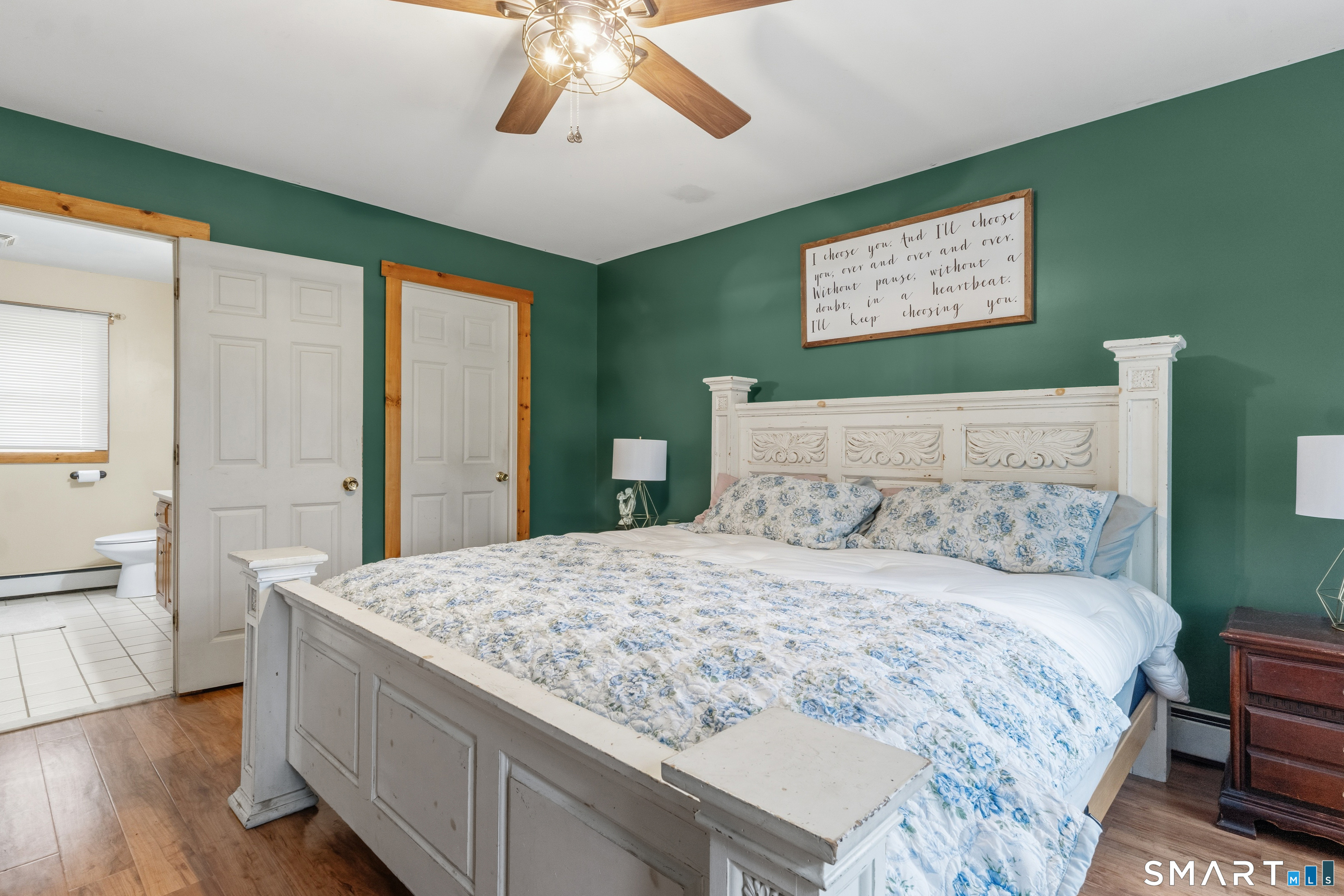 120 Hanover Versailles Road Sprague, CT 06330 - Photo 13 of 26 a bedroom with a large bed and a chandelier