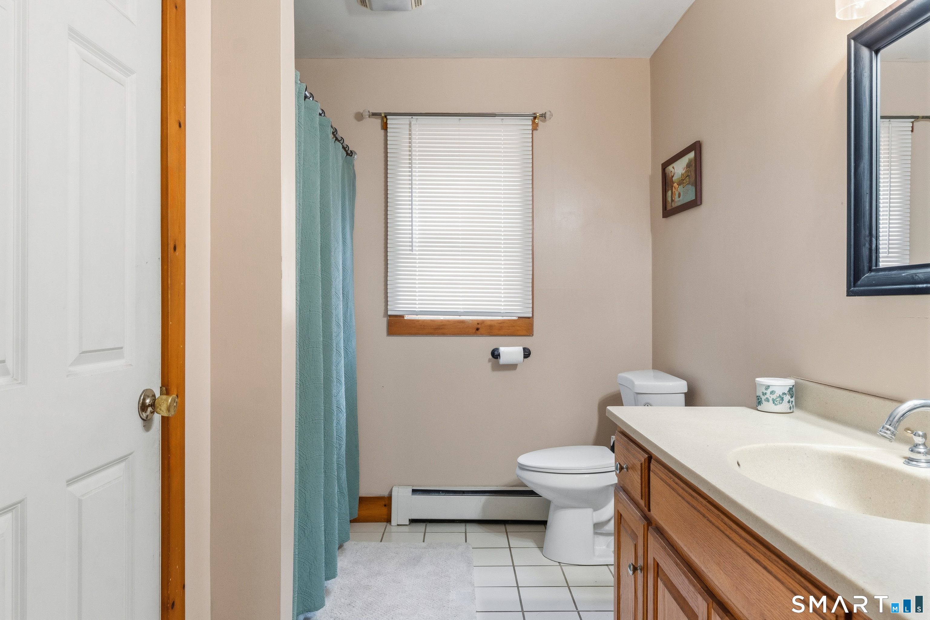 120 Hanover Versailles Road Sprague, CT 06330 - Photo 14 of 26 a bathroom with a granite countertop toilet a sink and a mirror