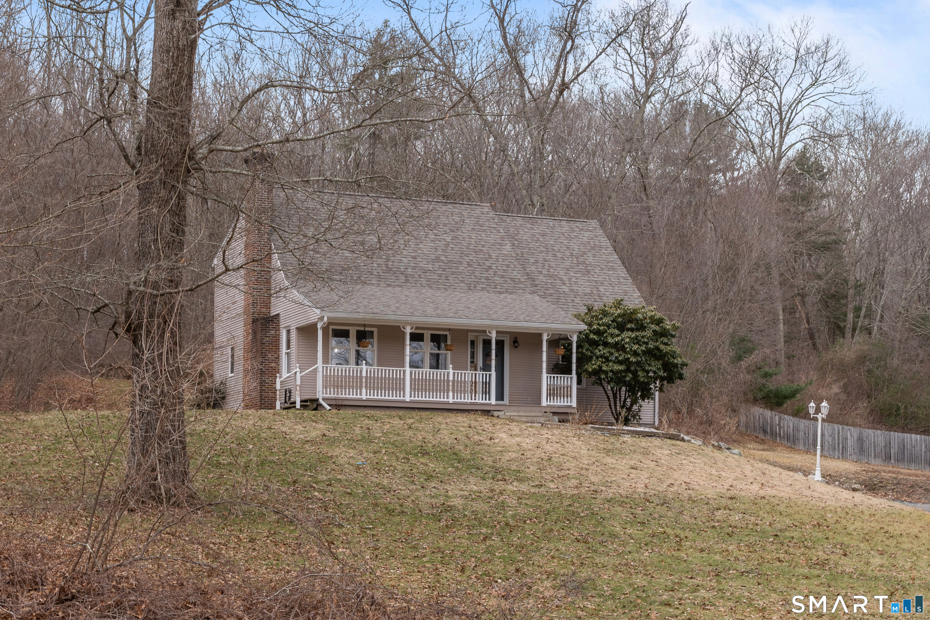 120 Hanover Versailles Road Sprague, CT 06330 - Photo 2 of 26 a front view of a house with a yard