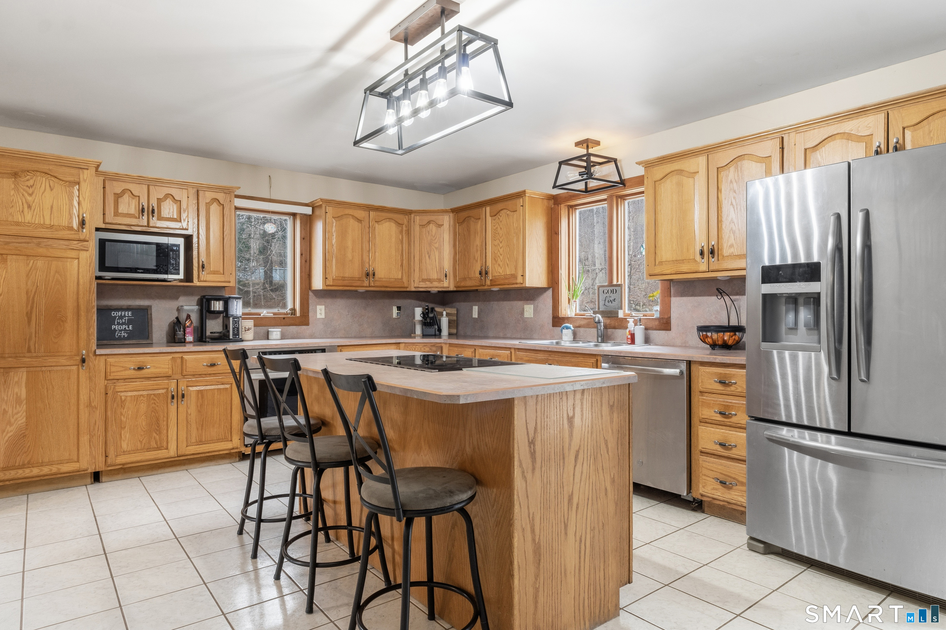 120 Hanover Versailles Road Sprague, CT 06330 - Photo 7 of 26 a kitchen with stainless steel appliances granite countertop a stove a sink dishwasher a refrigerator and cabinets with wooden floor