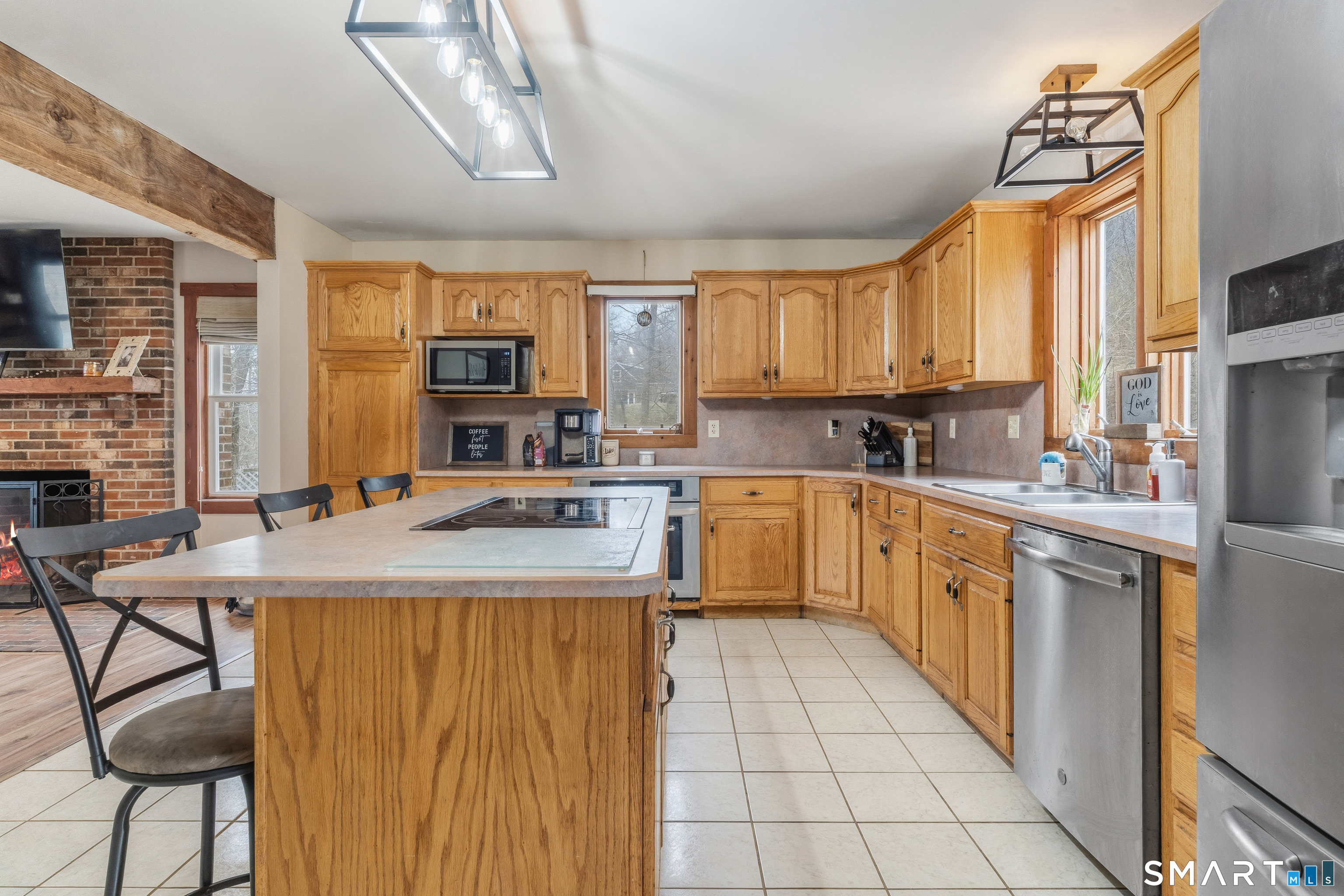 120 Hanover Versailles Road Sprague, CT 06330 - Photo 8 of 26 a kitchen with a stove a sink a microwave and cabinets