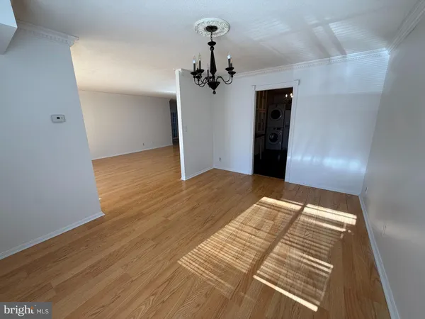 a kitchen with granite countertop white cabinets white stainless steel appliances and sink