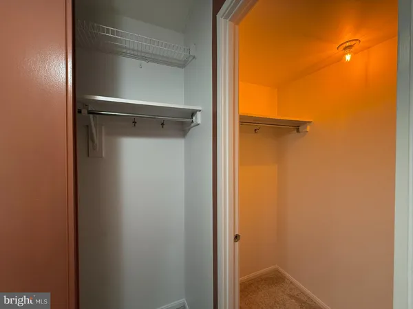 a view of a hallway with washer and dryer