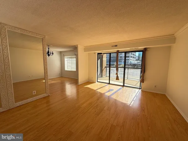 a view of a room with window and stairs
