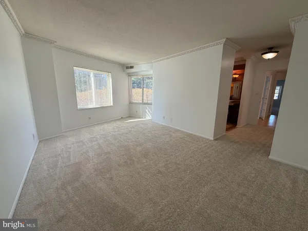 a view of a balcony with chair and iron gate