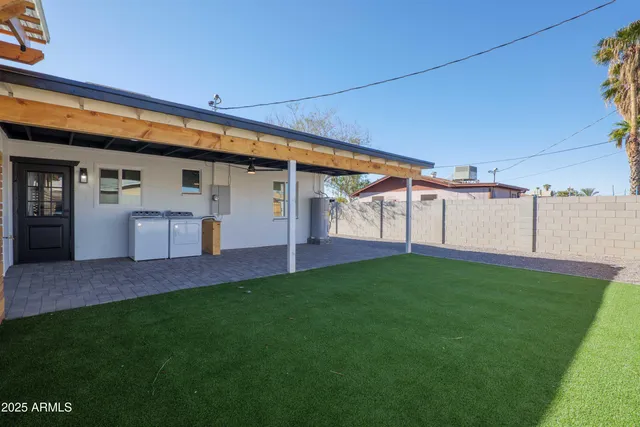 a view of a backyard with plants and a garden