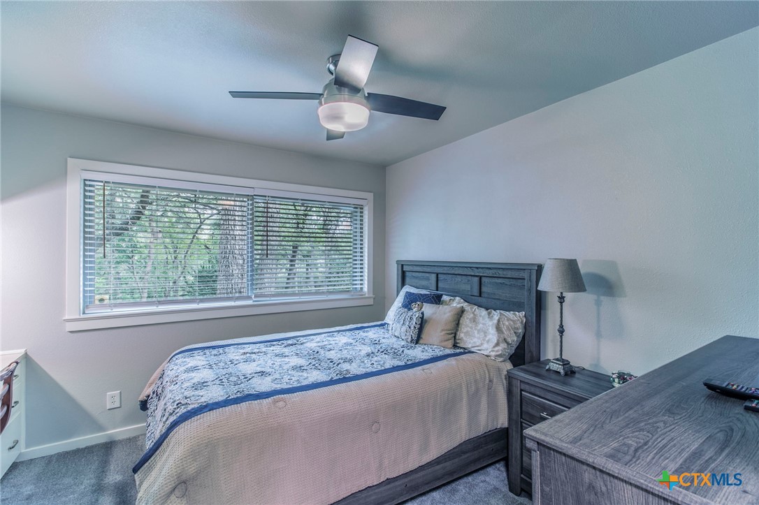 2518 Marlandwood Road Temple, TX 76502 - Photo 28 of 48 a bed sitting in a bedroom next to a window