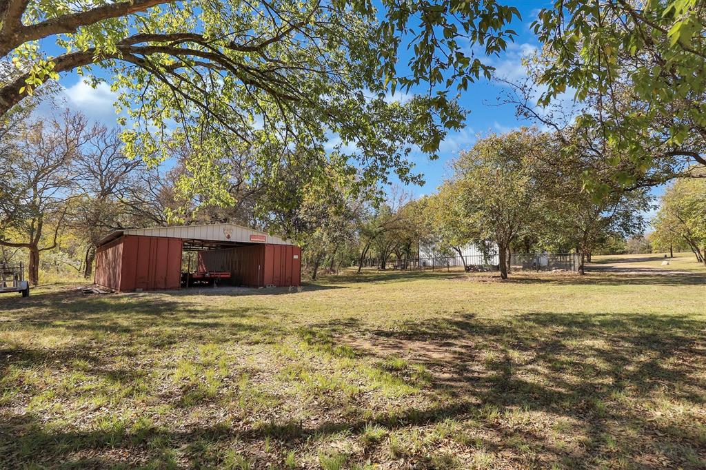 2601 Randell Lake Road Denison, TX 75020 - Photo 32 of 40 a view of big yard with large trees