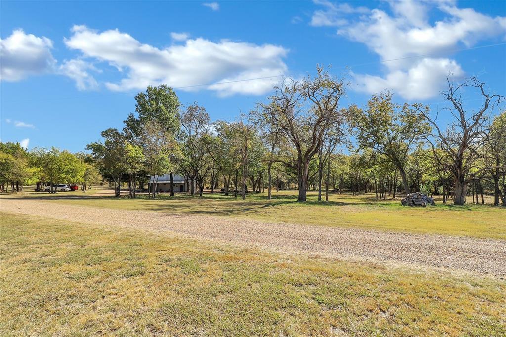 2601 Randell Lake Road Denison, TX 75020 - Photo 34 of 40 a swimming pool with trees in the background
