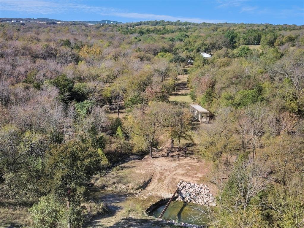 2601 Randell Lake Road Denison, TX 75020 - Photo 35 of 40 a view of a field with trees and houses
