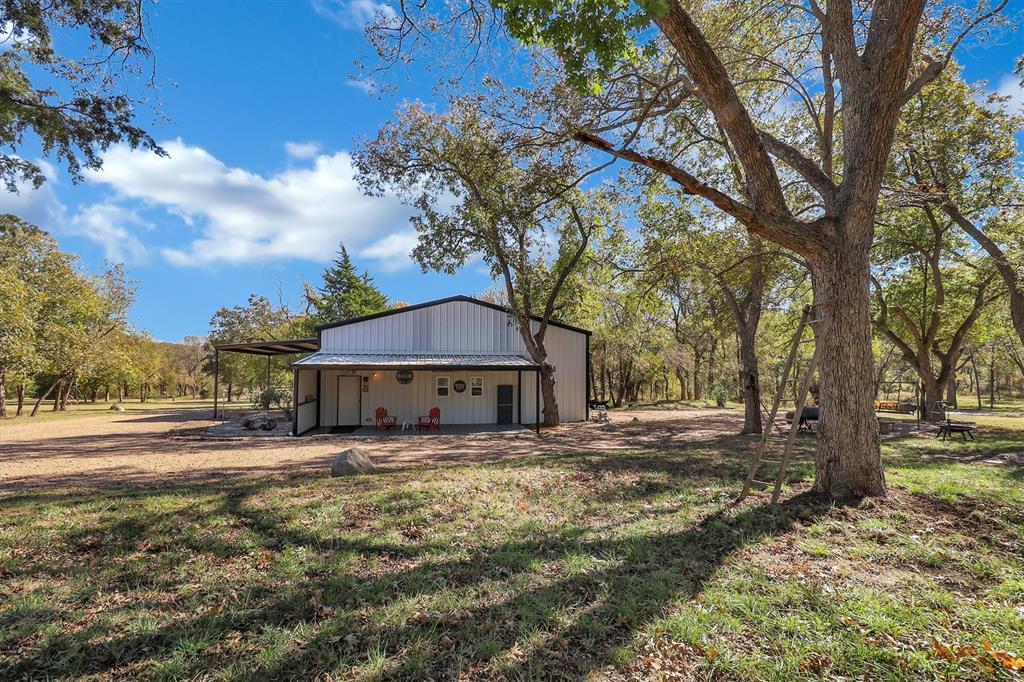 2601 Randell Lake Road Denison, TX 75020 - Photo 10 of 40 a view of a yard with large trees