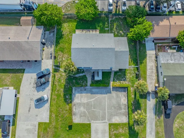 an aerial view of a house with a garden