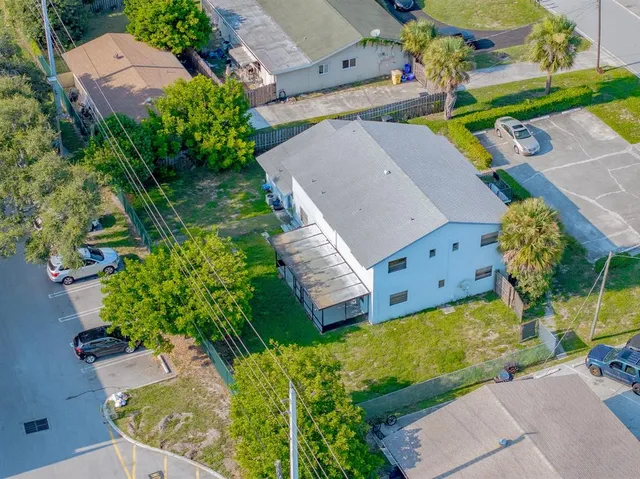 an aerial view of a house with a swimming pool