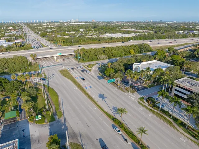 an aerial view of residential building and lake