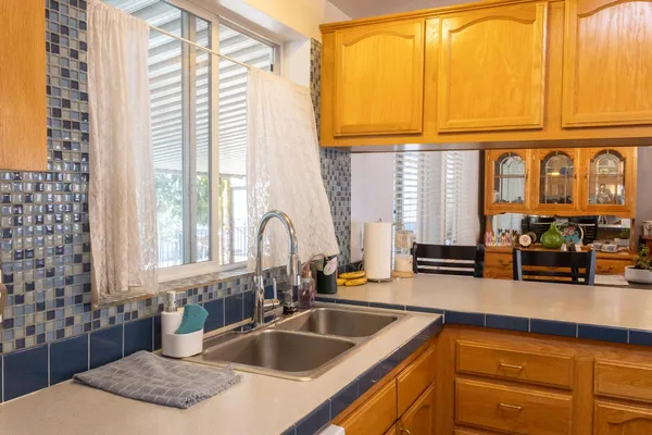 a kitchen with granite countertop a sink and a window