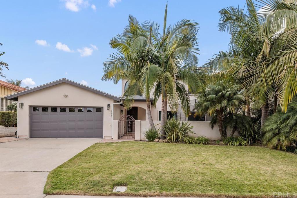 262 Chapalita Drive Encinitas, CA 92024 - Photo 1 of 30 a view of a white house with a yard and palm trees