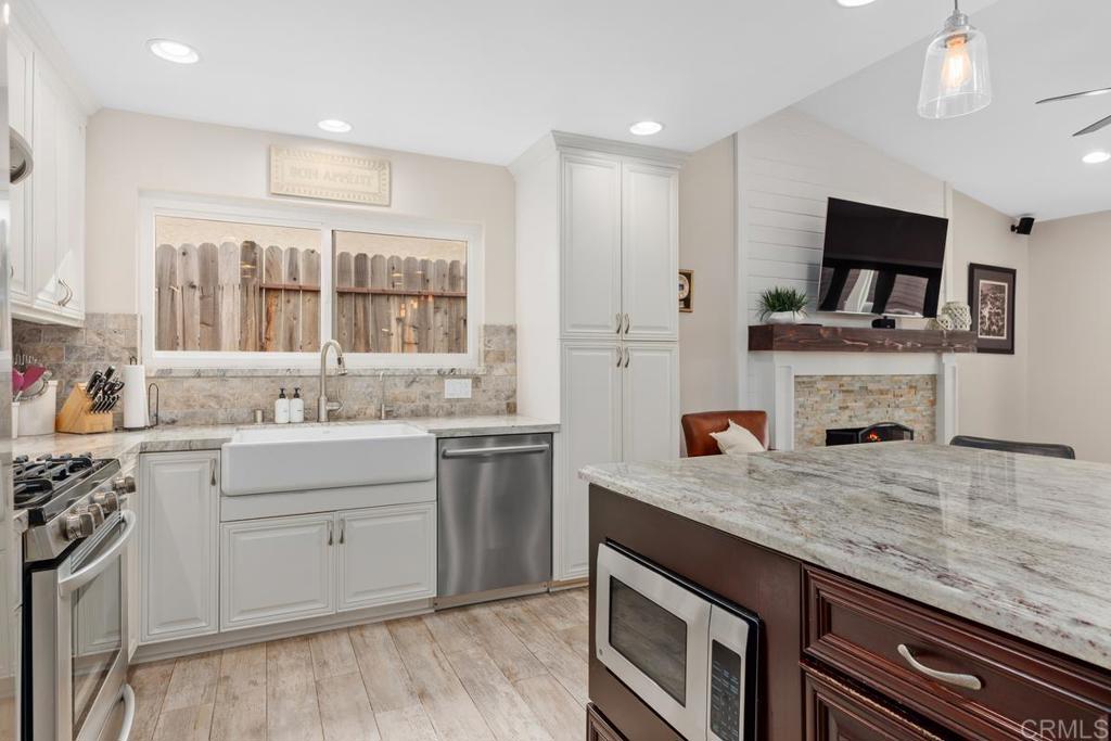 262 Chapalita Drive Encinitas, CA 92024 - Photo 11 of 30 a kitchen with sink stove and microwave