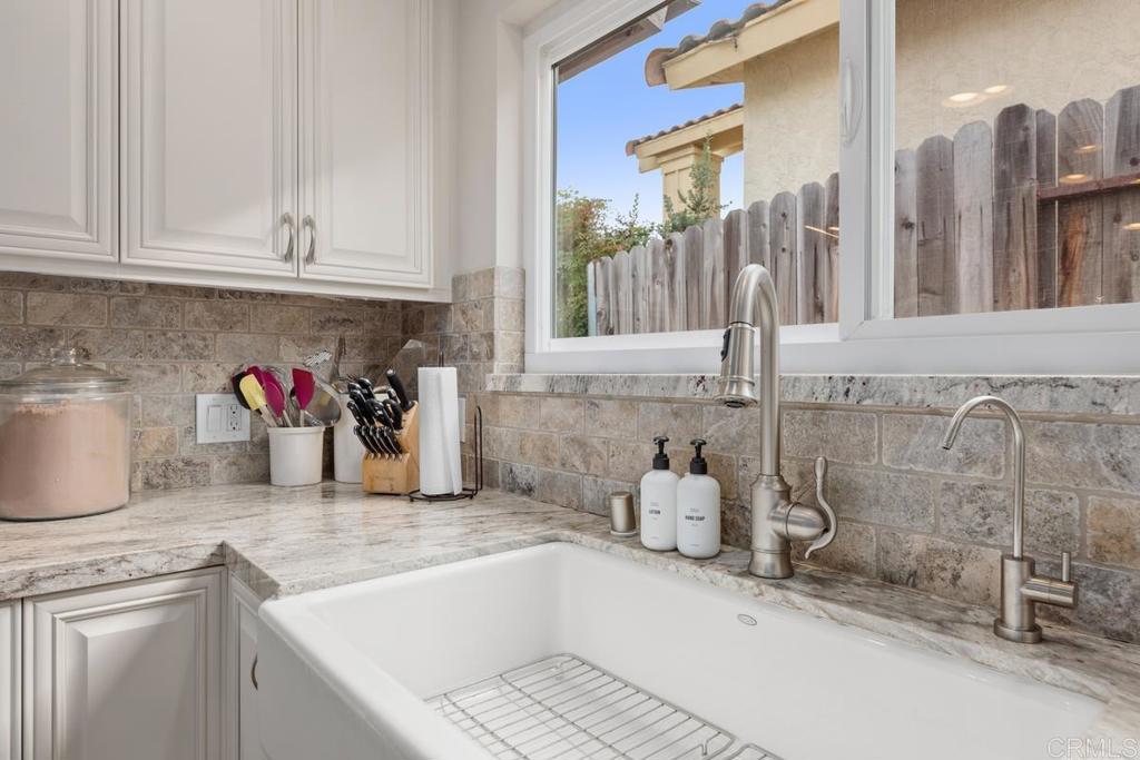 262 Chapalita Drive Encinitas, CA 92024 - Photo 12 of 30 a kitchen with a sink and cabinets