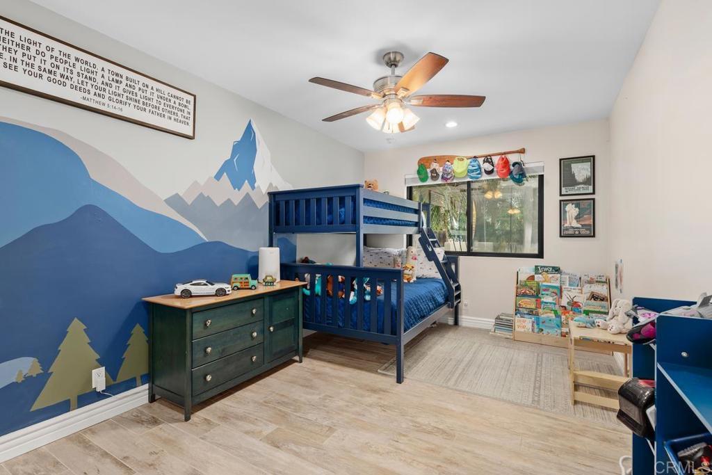 262 Chapalita Drive Encinitas, CA 92024 - Photo 18 of 30 a bedroom with a bed and wooden floor