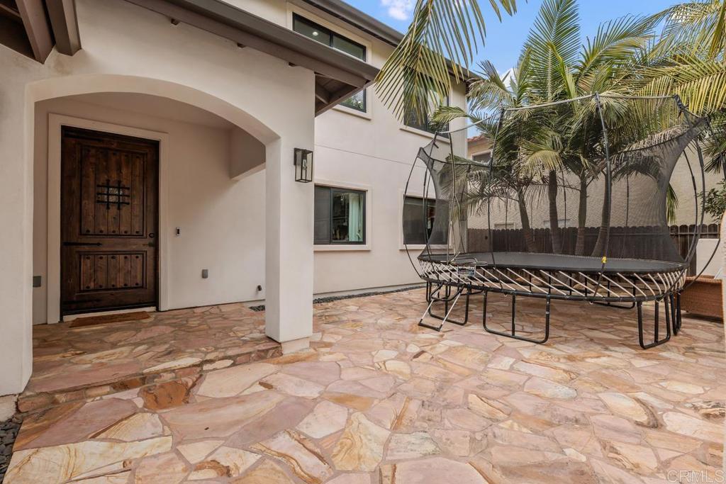 262 Chapalita Drive Encinitas, CA 92024 - Photo 2 of 30 a view of a house with a bench in a patio
