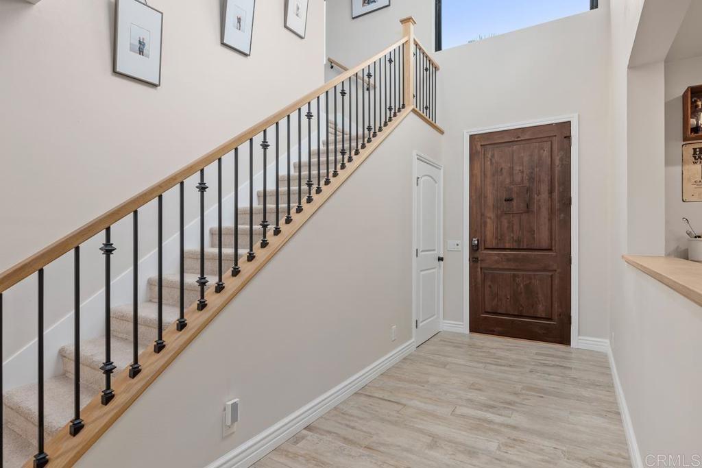 262 Chapalita Drive Encinitas, CA 92024 - Photo 4 of 30 a view of a hallway with wooden floor and entryway
