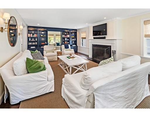 50 Garrison Road Hingham, MA 02043 - Photo 11 of 30 a living room with furniture a flat screen tv and a fireplace