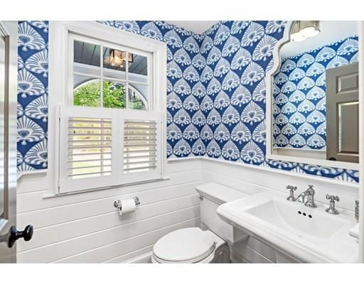 a bathroom with a sink a toilet and a bathtub