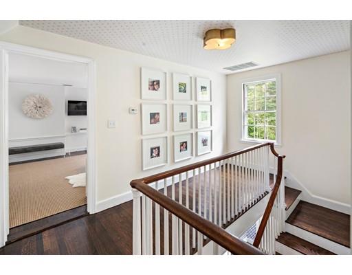 50 Garrison Road Hingham, MA 02043 - Photo 18 of 30 a view of a hallway with wooden floor and windows