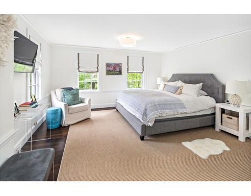 50 Garrison Road Hingham, MA 02043 - Photo 19 of 30 a spacious bedroom with a bed couch and a window