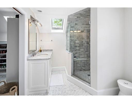 50 Garrison Road Hingham, MA 02043 - Photo 20 of 30 a bathroom with a sink a toilet a mirror and shower