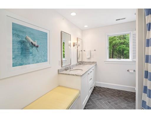 50 Garrison Road Hingham, MA 02043 - Photo 25 of 30 a bathroom with a tub sink and mirror