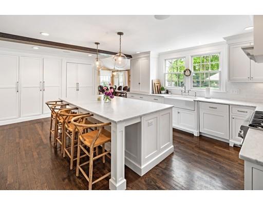 50 Garrison Road Hingham, MA 02043 - Photo 5 of 30 a view of a kitchen counter space a sink wooden floor and windows