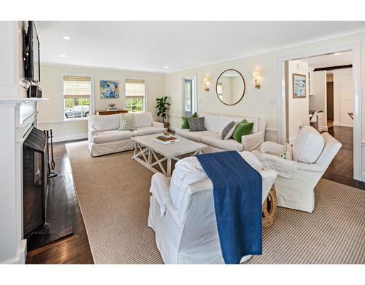 50 Garrison Road Hingham, MA 02043 - Photo 10 of 30 a living room with furniture a fireplace and a potted plant