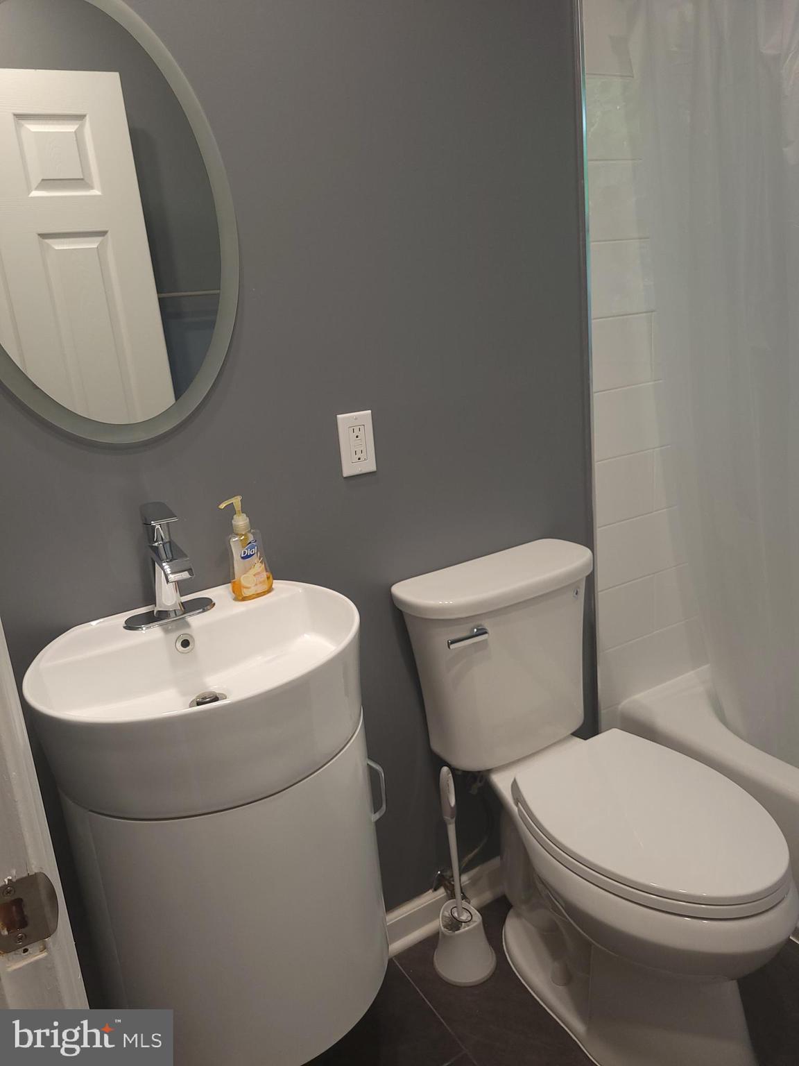 2250 North Quantico Street Arlington, VA 22205 - Photo 18 of 47 a white toilet sitting next to a bathroom sink