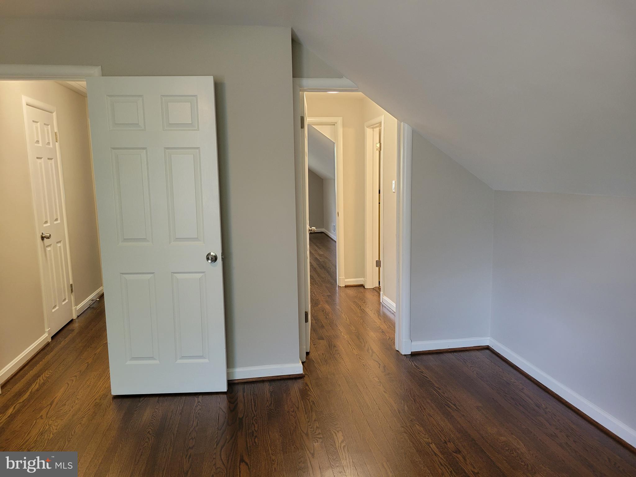 2250 North Quantico Street Arlington, VA 22205 - Photo 26 of 47 a view of a hallway with wooden floor