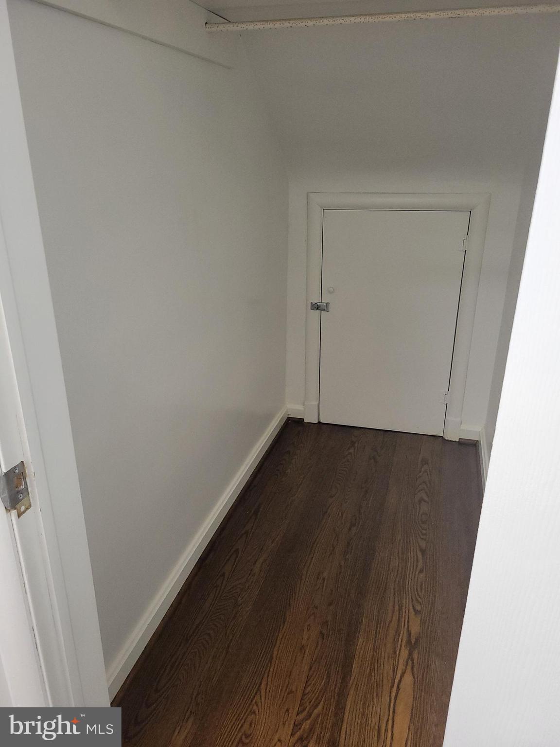 2250 North Quantico Street Arlington, VA 22205 - Photo 30 of 47 an empty room with wooden floor