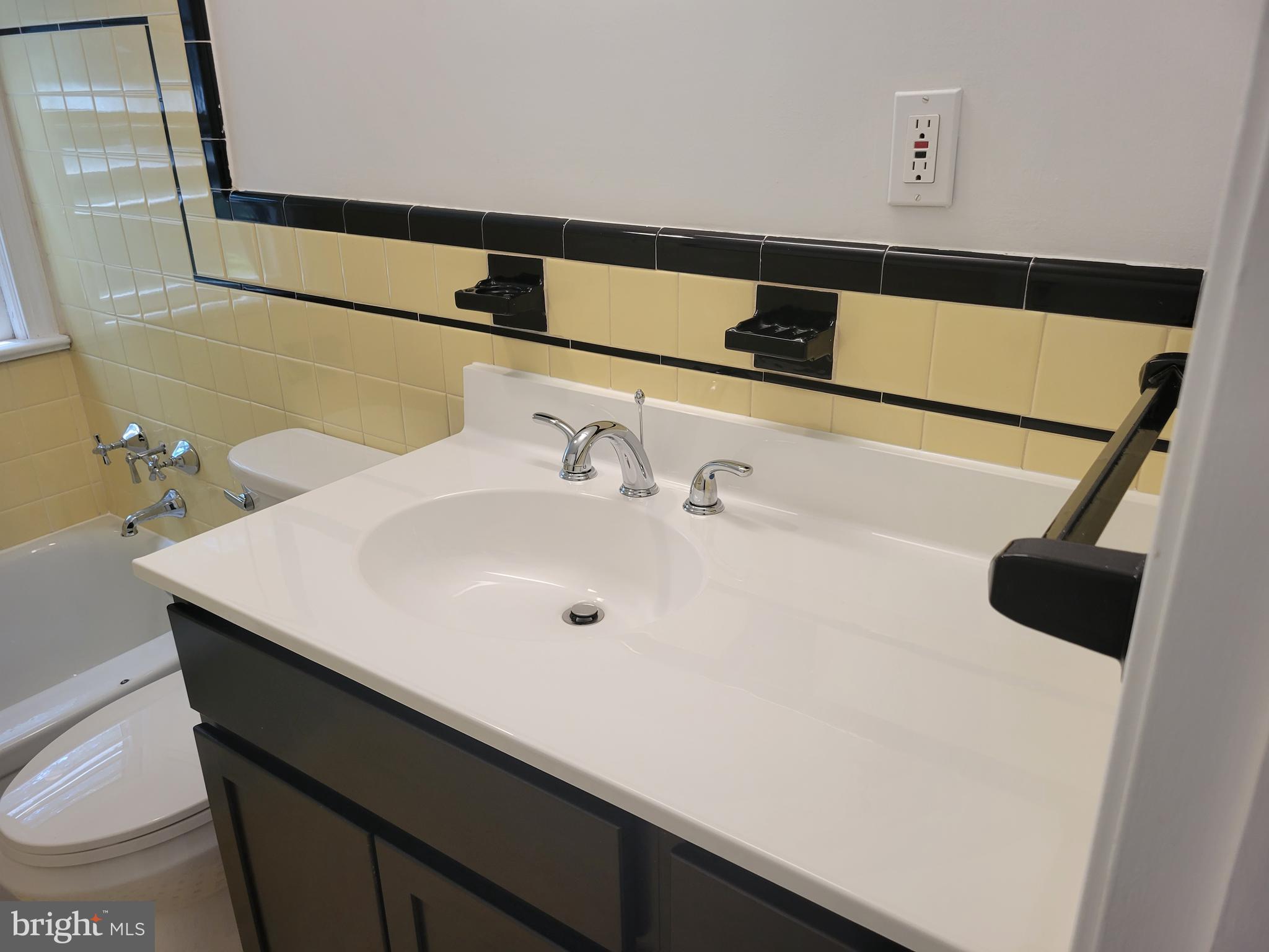 2250 North Quantico Street Arlington, VA 22205 - Photo 32 of 47 a bathroom with a sink and a mirror