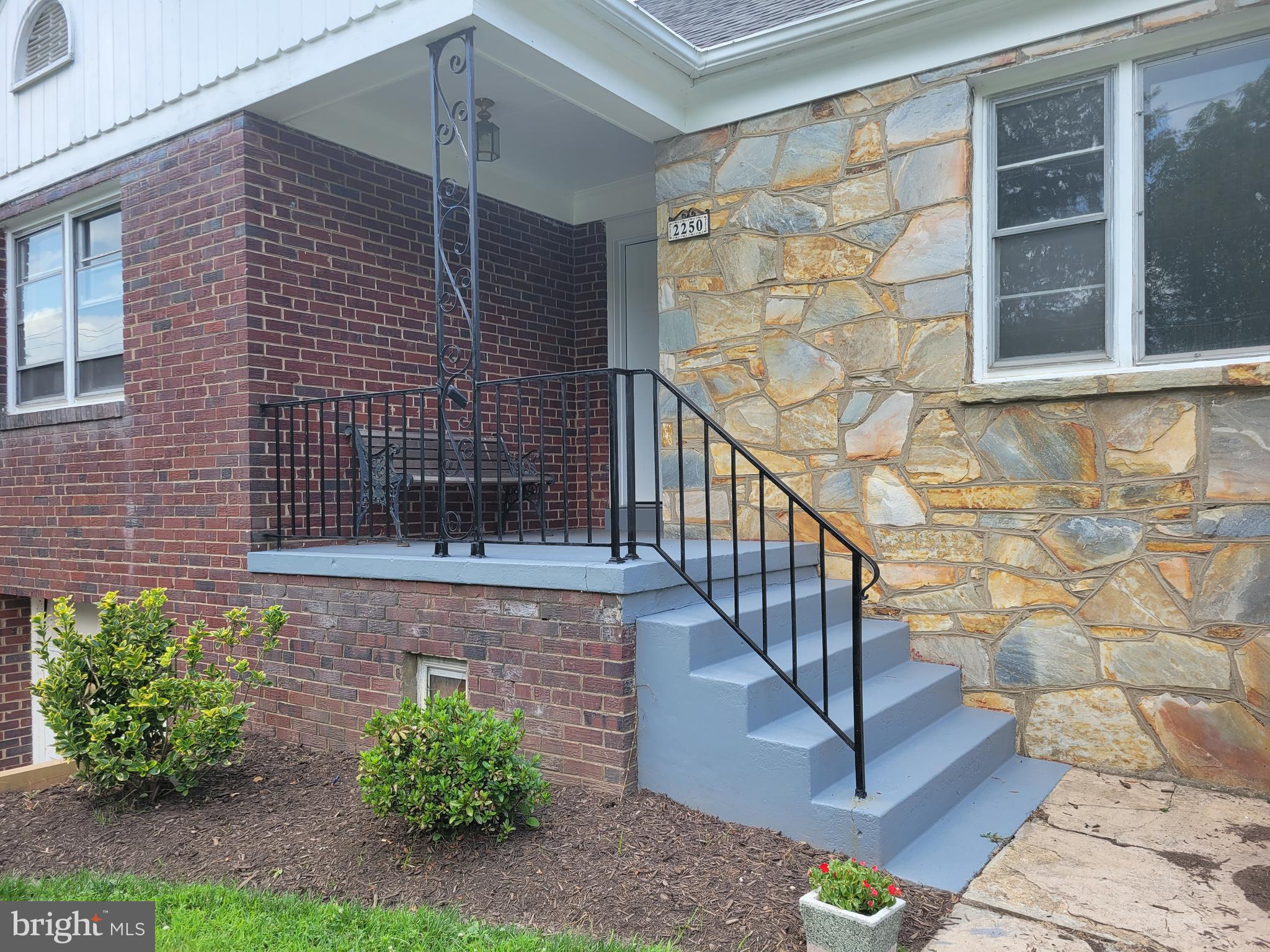 2250 North Quantico Street Arlington, VA 22205 - Photo 44 of 47 a view of front door of house with potted plant