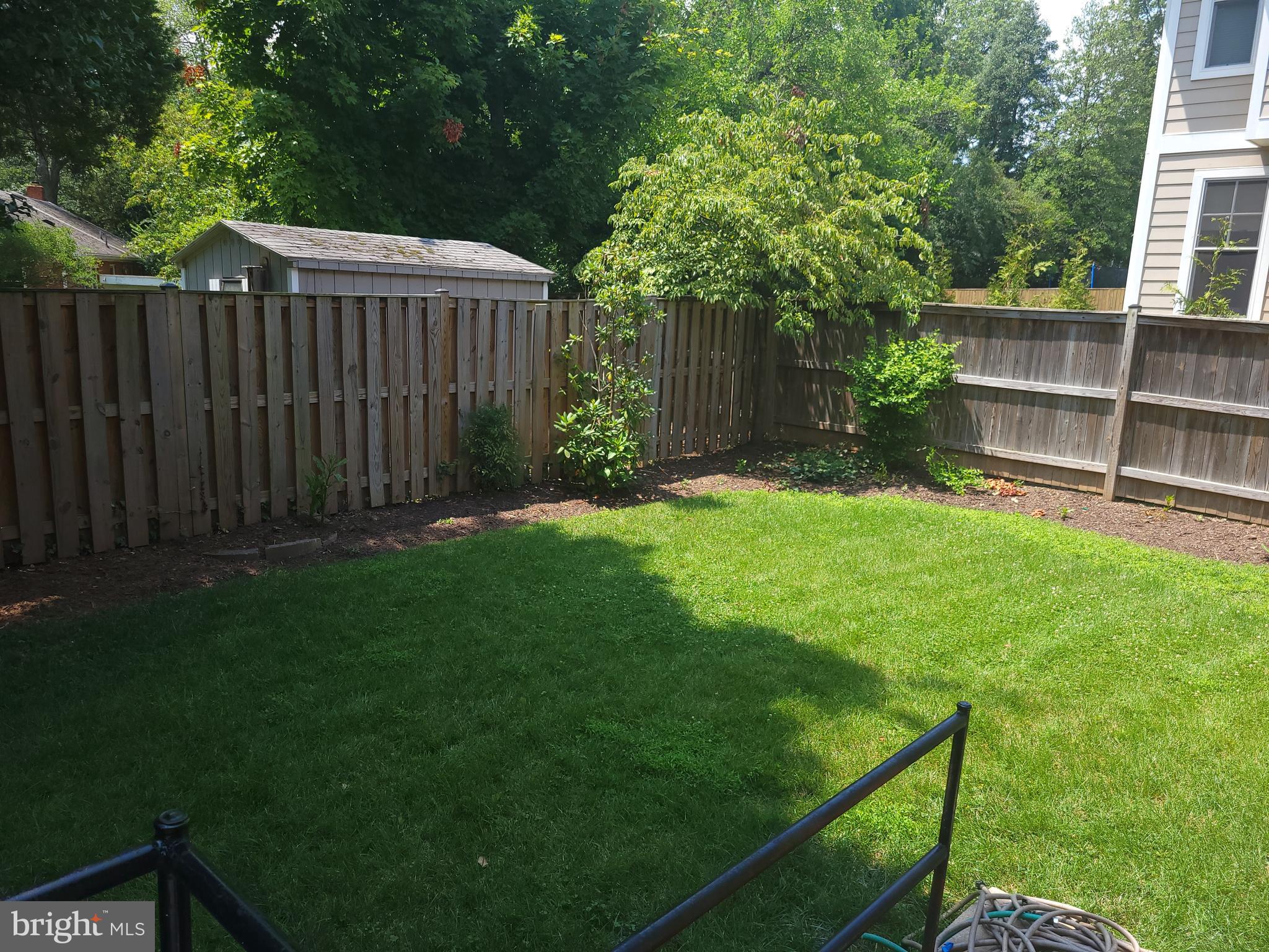 2250 North Quantico Street Arlington, VA 22205 - Photo 45 of 47 a view of a backyard with a small cabin and wooden fence