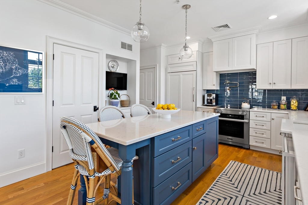1090 Shore Road, Unit 4 Bourne, MA 02559 - Photo 12 of 42 a kitchen with a sink appliances and cabinets