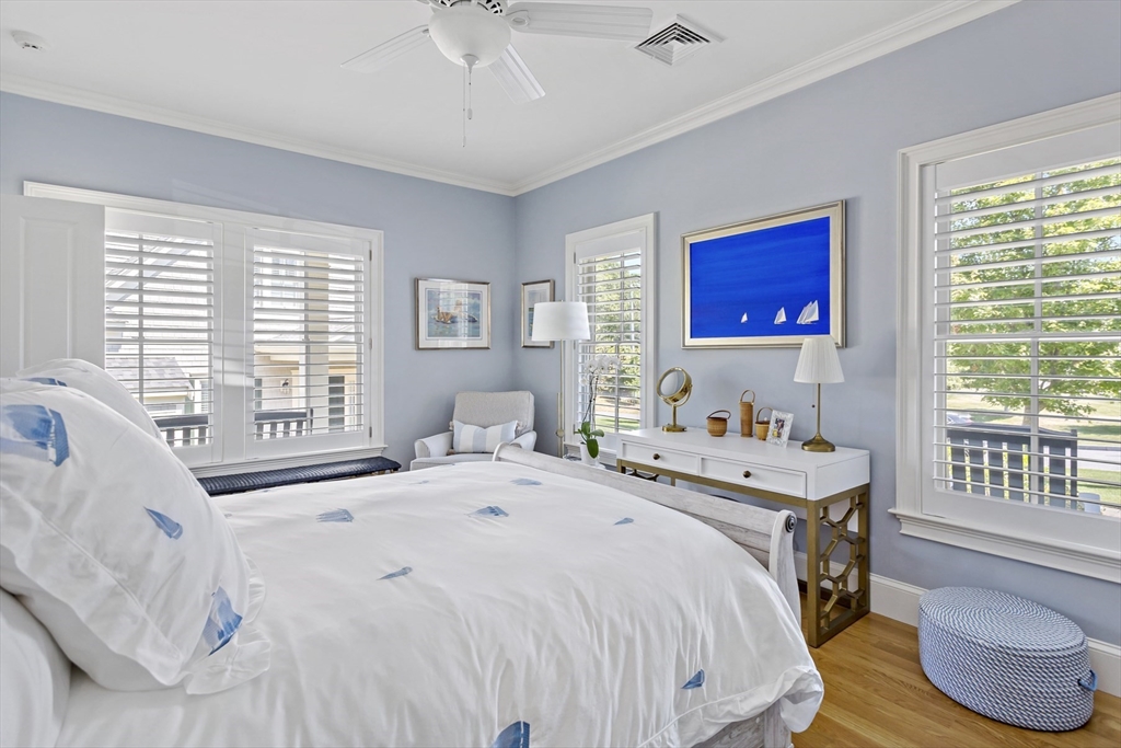 1090 Shore Road, Unit 4 Bourne, MA 02559 - Photo 15 of 42 a bedroom with a bed and a table