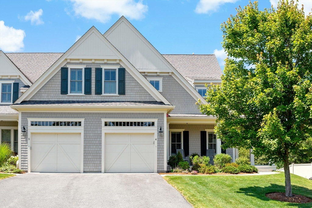 1090 Shore Road, Unit 4 Bourne, MA 02559 - Photo 2 of 42 a front view of a house with garden