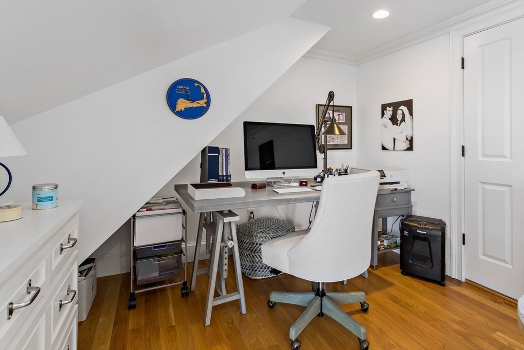 1090 Shore Road, Unit 4 Bourne, MA 02559 - Photo 30 of 42 a view of a workspace with furniture and wooden floor