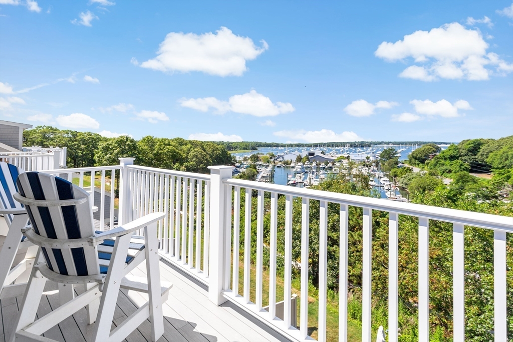 1090 Shore Road, Unit 4 Bourne, MA 02559 - Photo 31 of 42 a view of a city from a balcony