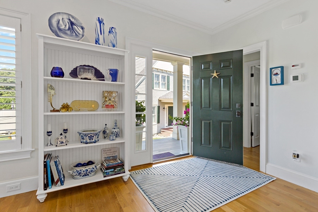 1090 Shore Road, Unit 4 Bourne, MA 02559 - Photo 5 of 42 a view of a bedroom with baby crib and window