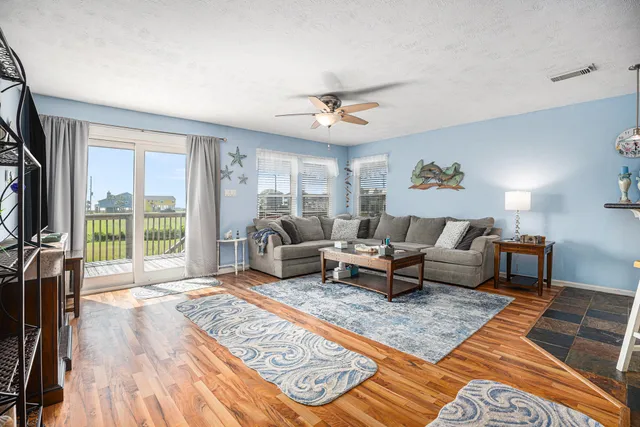 a living room with furniture and a rug