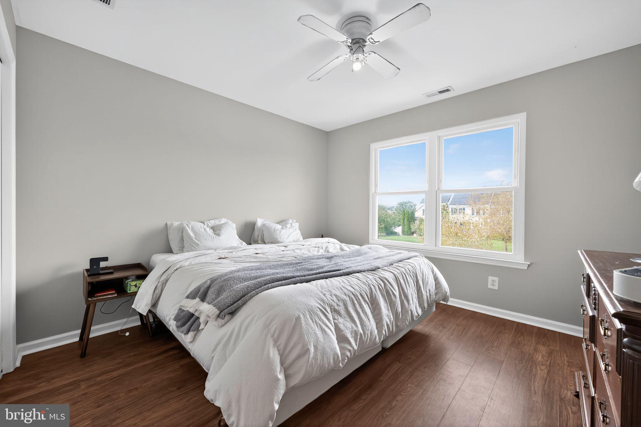 562 Partridge Court Mickleton, NJ 08056 - Photo 19 of 33 a bedroom with a bed and wooden floor