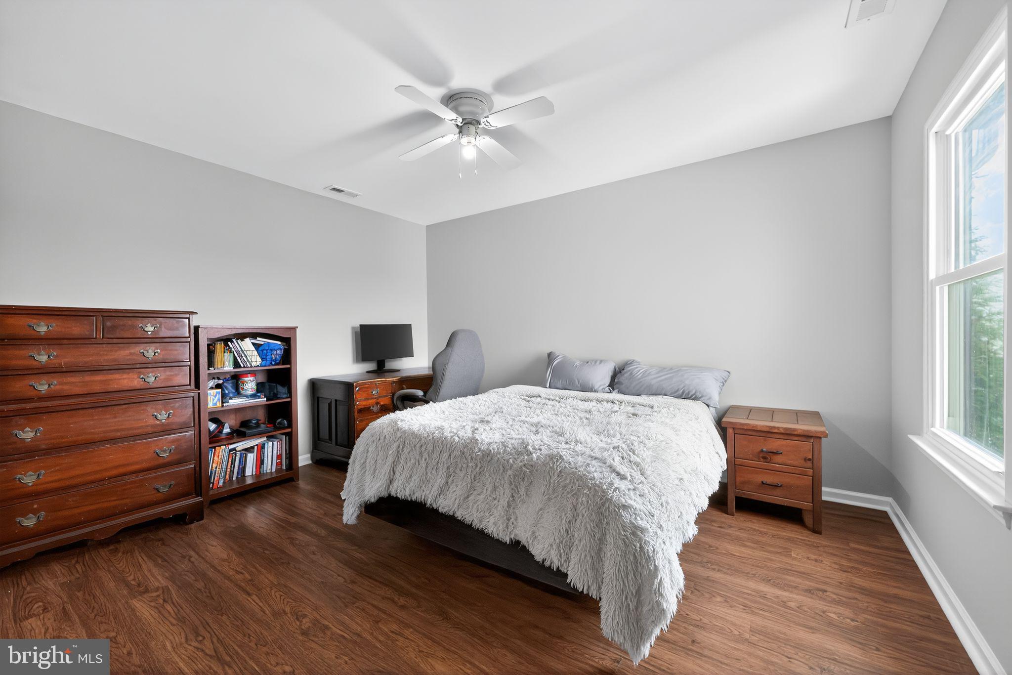 562 Partridge Court Mickleton, NJ 08056 - Photo 20 of 33 a bedroom with a bed and a chandelier